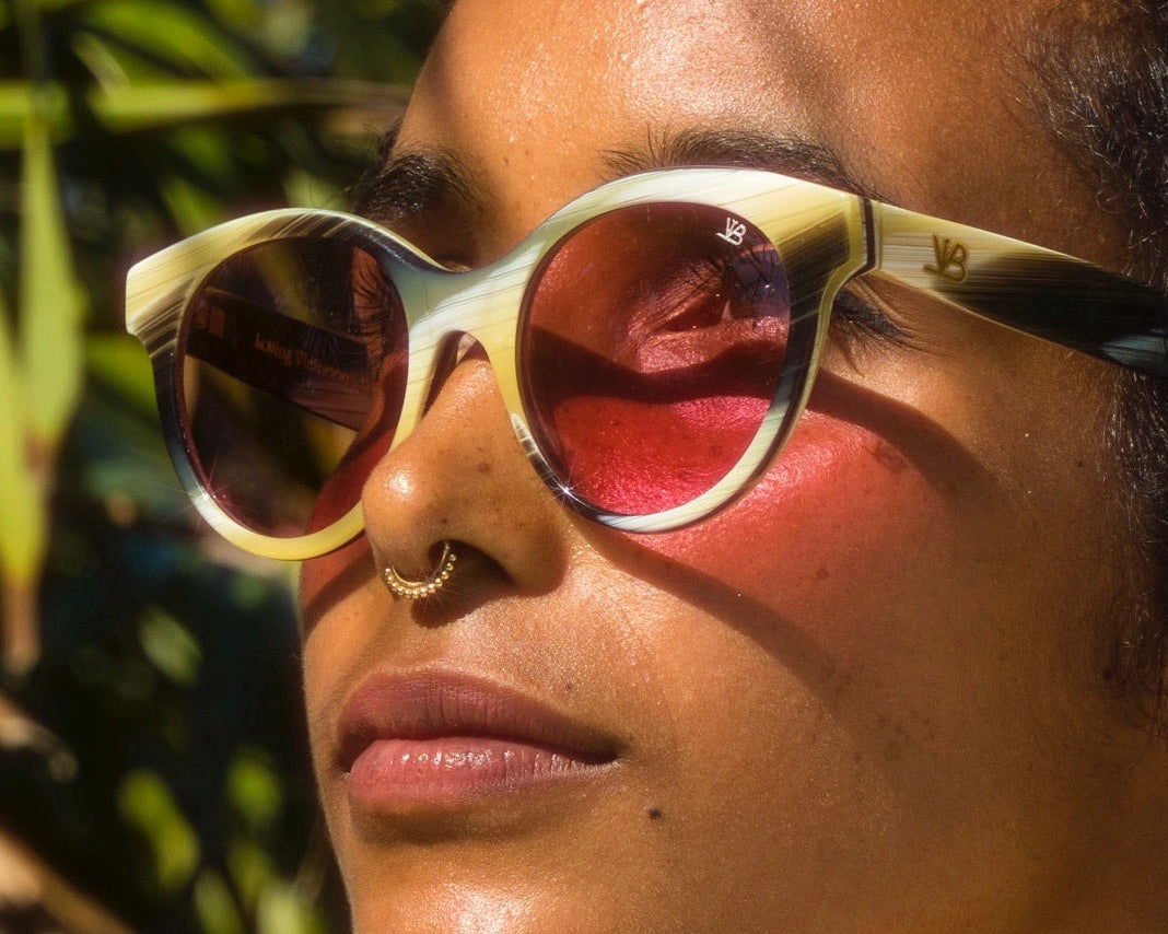Woman wearing rounded sunglasses