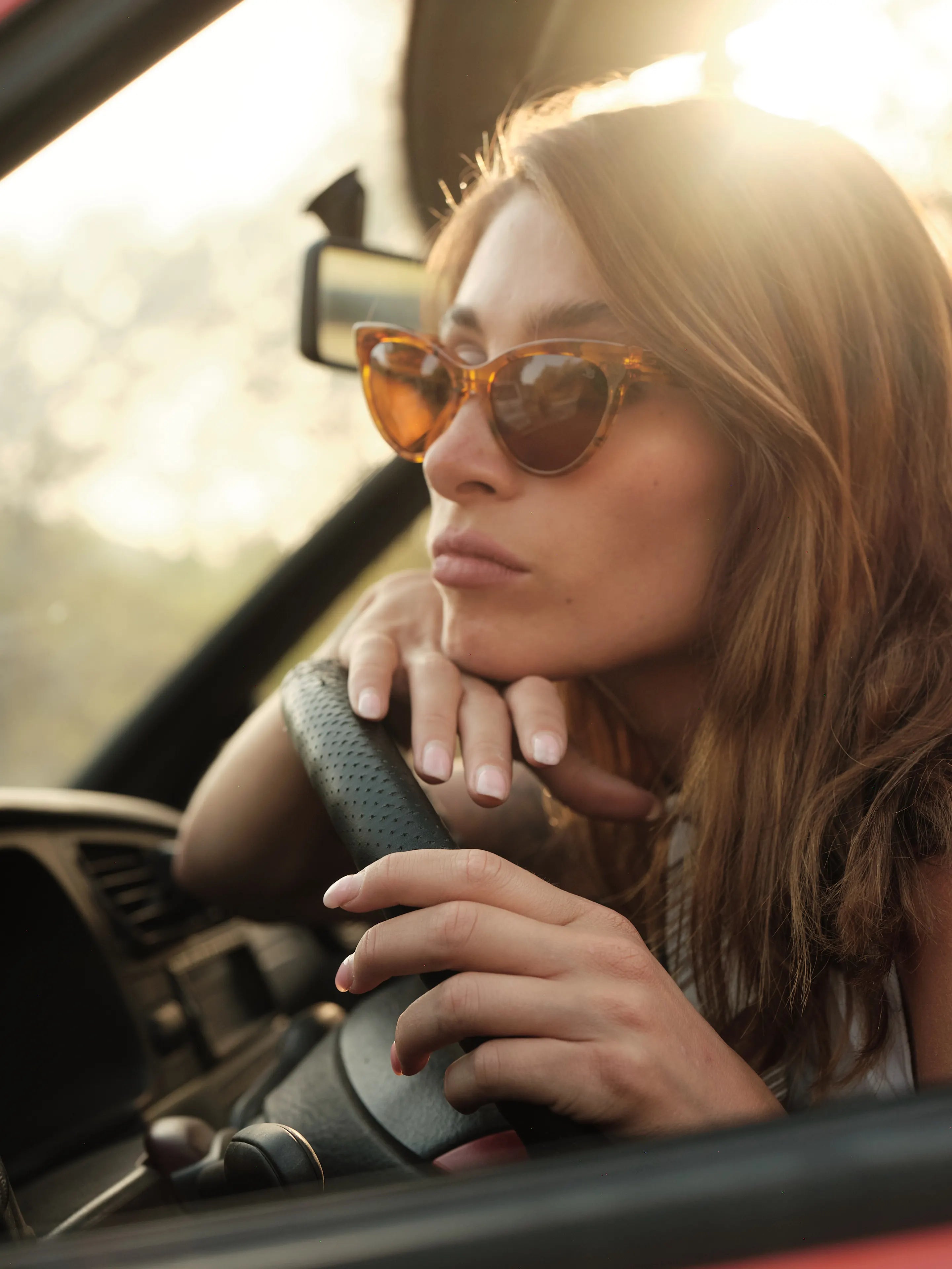 Woman with lenses in car