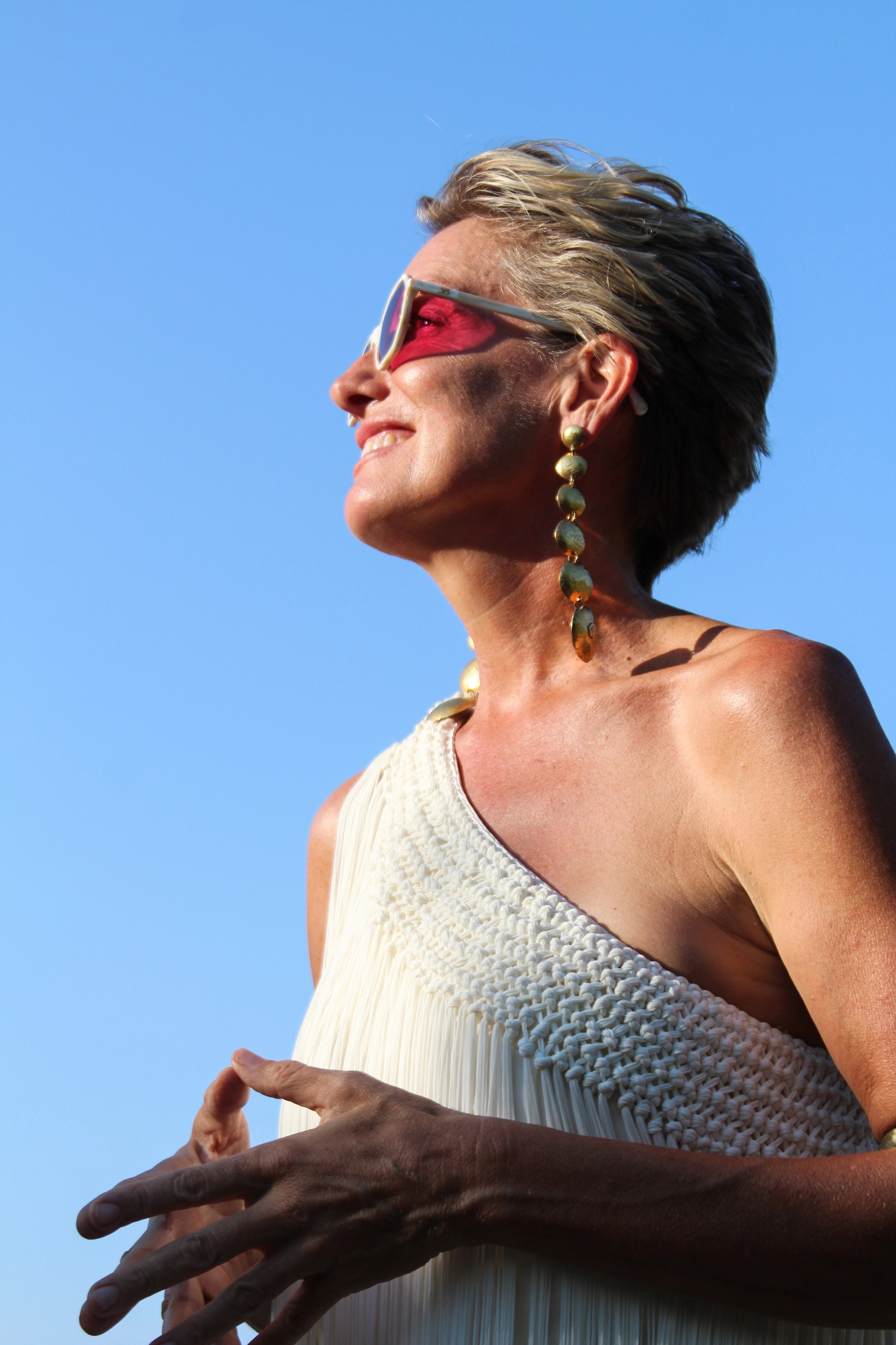Woman with sunglasses and blue sky